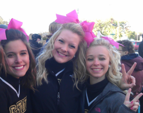 Kami Zahner in cheer uniform with friends