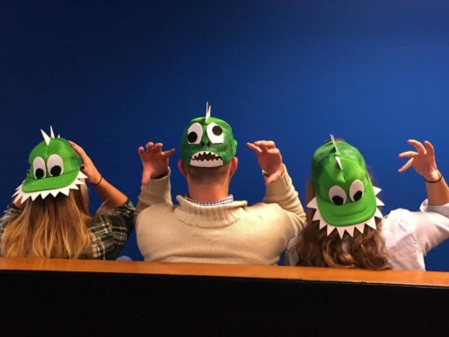 Taylor Russo and two co workers with "dinosaur hats"