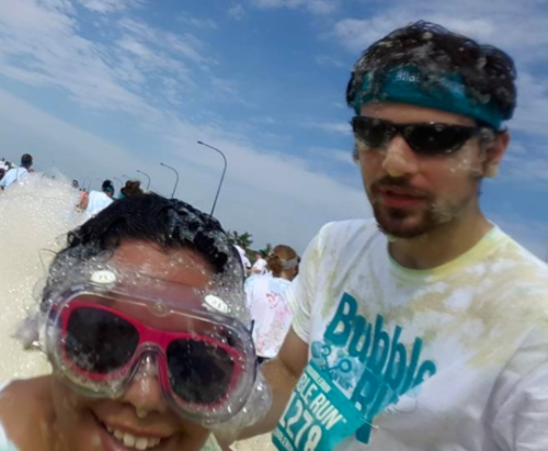 Thomas with wife at Bubble run