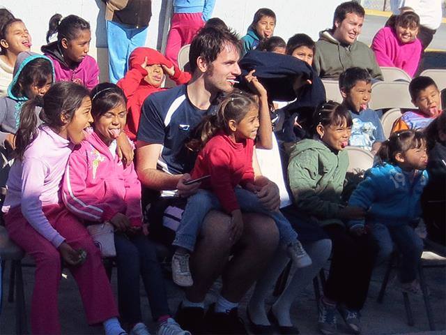 Thomas in Mexico with a group of children