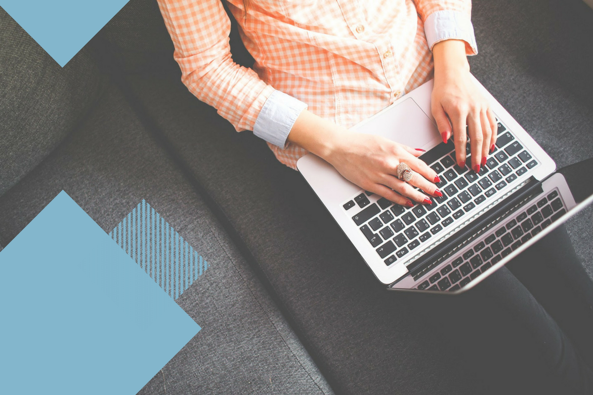 Laptop sitting on woman's lap with light blue geometric shapes on sides of photo