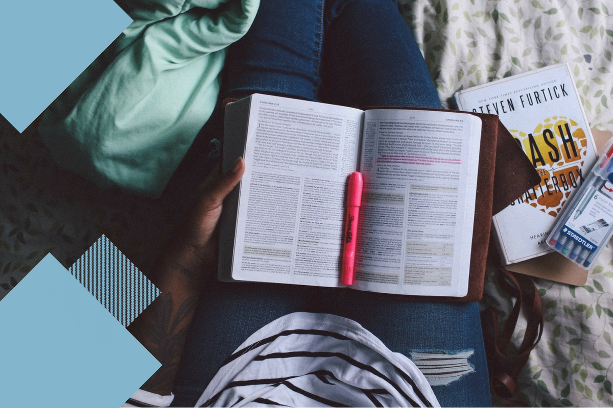 book sitting on a person's lap