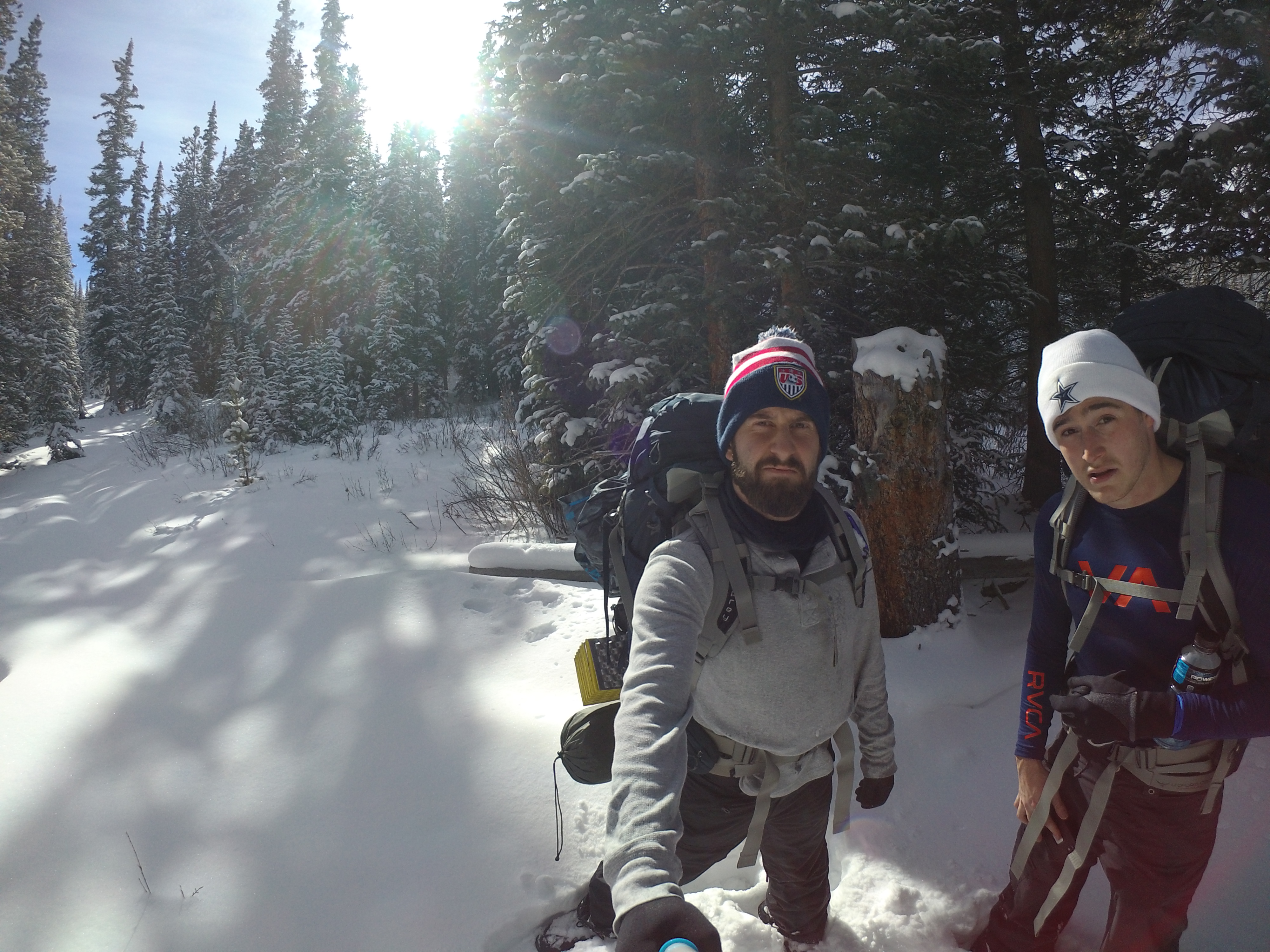 Jarred Mosher and friend Hiking through the snow