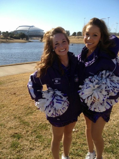 Julie and friend in cheerleader outfits