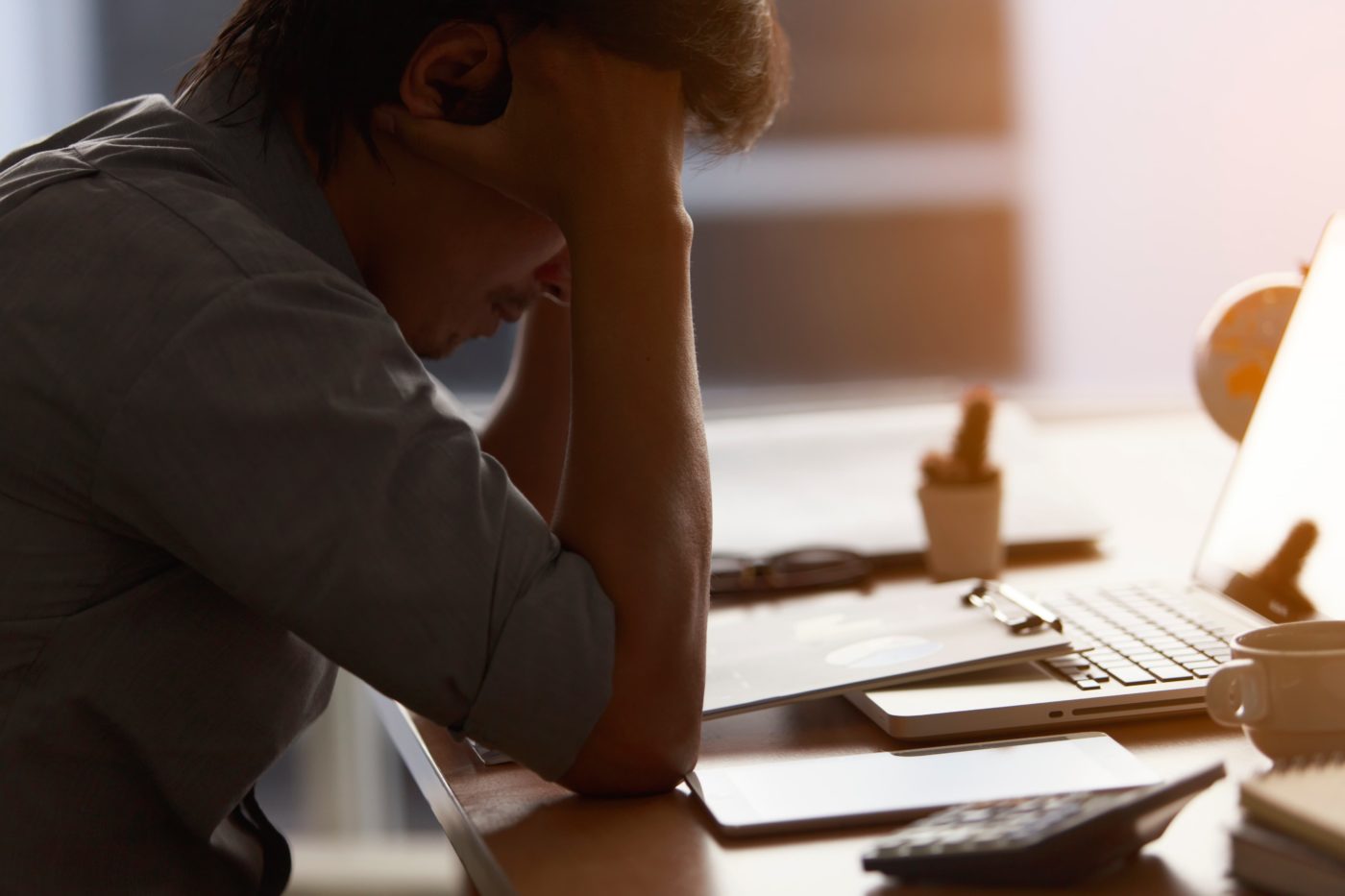 man stressed on computer