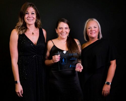 HILLS Properties' employees accept the best website award.