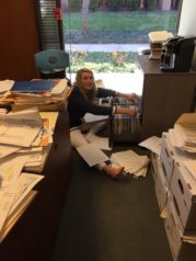 Maddie helping sort paper for the Accounting Department